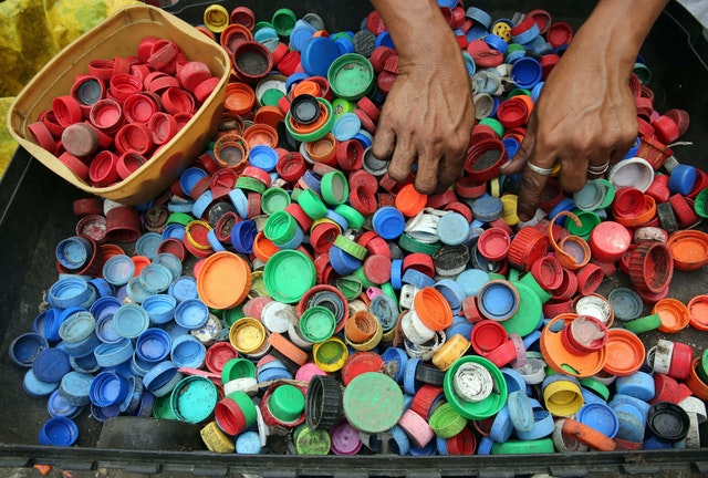 a box of plastic bottle caps